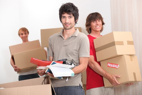 Professional movers handling furniture
